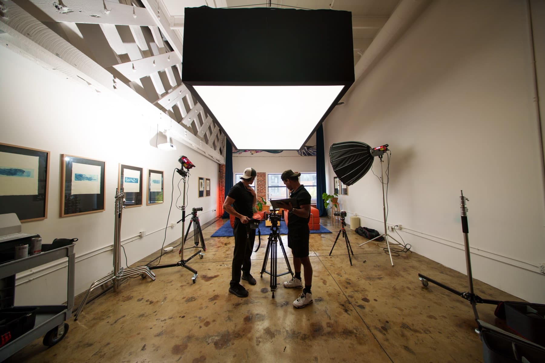 MediaGeekz crew preparing cameras and lighting in a production studio